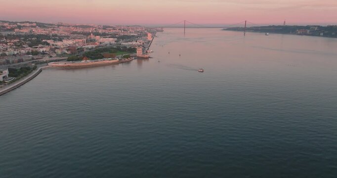 Tagus River and Lisbon shoreline at sunset, aerial drone wide shot, Portugal