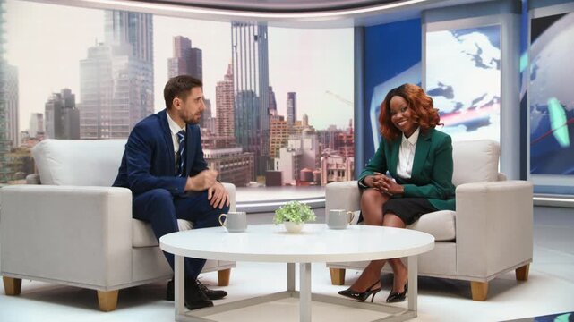 Morning Talk Show Daytime TV: Interview With a White Male Host and Black Female Guest Journalist Covering Current Events, Local, Everyday News. Mockup Broadcasting Playback, Studio Screen Replacement