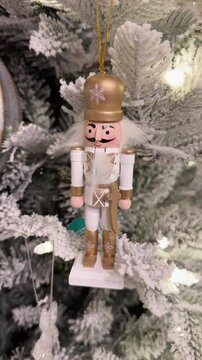 Nutcracker Christmas ornament hanging on tree, wooden decor