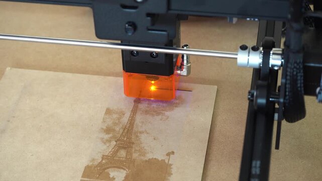 Laser engraving on MDF using diode laser machine, macro view