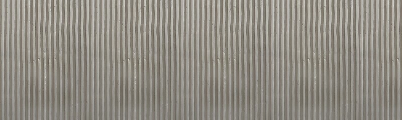 Wide Panoramic View of Brownish Grey Corrugated Concrete Surface with Vertical Linear Pattern © MonTeArt