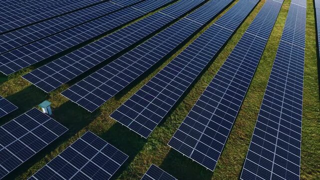 Solar panels installed in field, Aerial top view. Concept alternative clean energy generator for environment.