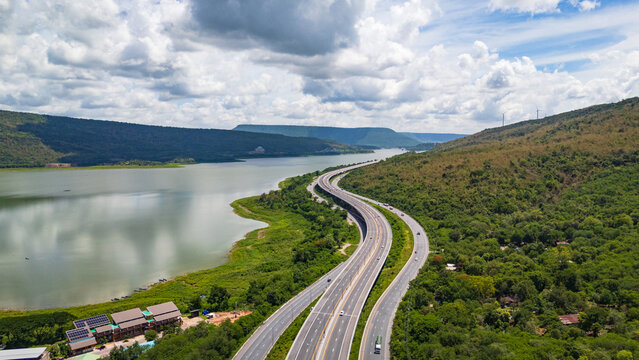Drone shot The M6 motorway Nakhon Ratchasima Province - Bang Pa-in Lam Ta Khong River and Mountain. Motorway Korat Thailand