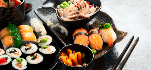 Various types of sushi including nigiri and rolls. Asian food concept. © bit24