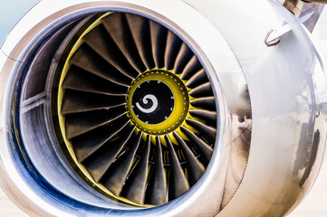 Front engine cowling and turbine blades of the engine of a jet aircraft © Stephen