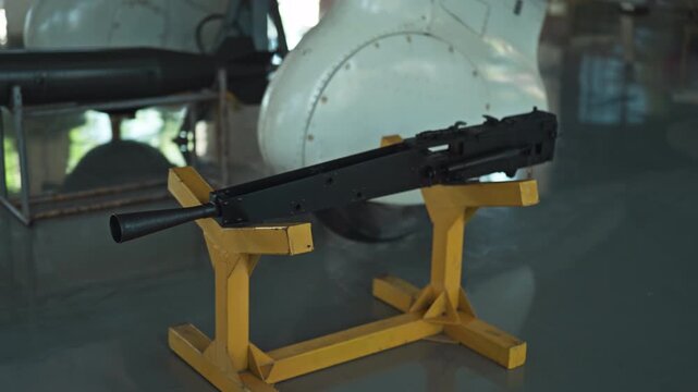 Military machine gun standing on the base in the stands of the air-to-ground system. Weapon technology.