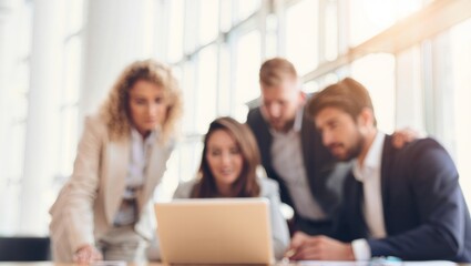 Obraz premium Business people working together, analyzing information on a computer. Collaborating on a project in a bright, defocused corporate setting