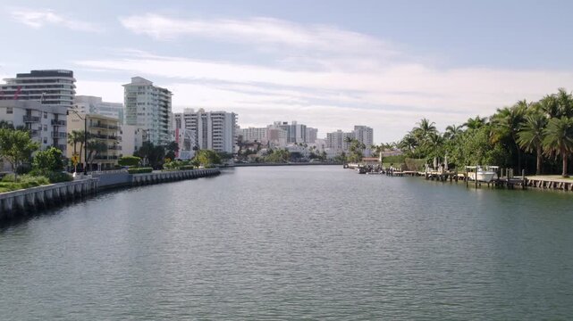 Drone flying low over lake in the city of Miami, Florida