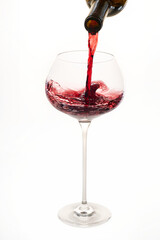 Red wine pouring into a elegant glass