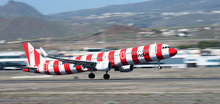 Tenerife, Spain february 11st, 2026. Airbus A321-211 Condor (Red Passion Livery) airlines aircraft is departing from the Tenerife. Panning shot, background becomes blurred