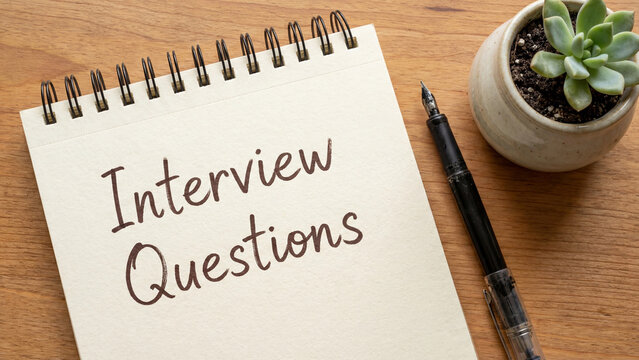 Interview questions preparation notebook on desk for job applicant candidate readiness and hiring manager recruitment process planning for professional career advancement and talent acquisition