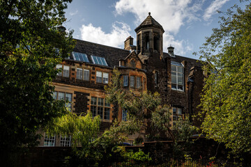 Historic stone building with skylights and turrets in a Scottish city © 9parusnikov