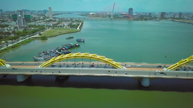 Panoramic aerial view of the dragon bridge crossing the han river in the modern city of da nang