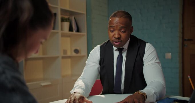 Business Manager Explaining Terms During Job Interview