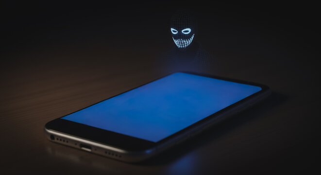 Hacker's digital ghost emerges from a smartphone, symbolizing online data theft, cybercrime, and cybersecurity threats in the modern connected world.