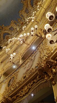 Opulent golden interior of the historic Teatro La Fenice in Venice, Italy.