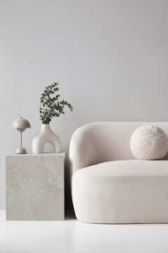 Modern scandinavian style interior with chair, lamp and trendy vase, Home staging and minimalism concept, Soft natural light, calm cozy atmosphere. Empty gray wall background