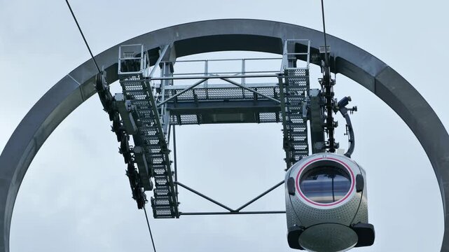 Cable Car gondola passing through a support tower in London
