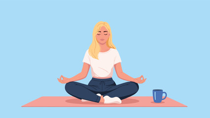 Fototapeta premium Young blonde woman meditating in a lotus pose on a yoga mat with her eyes closed and a blue mug sitting next to her on a blue background.