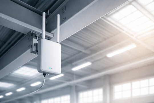 Wireless access point mounted on metal beam in spacious industrial setting showcasing edge technology and automation with AI integration