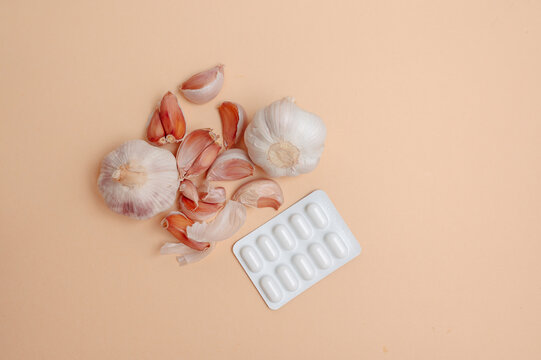 Juxtaposition Of Herbal Remedy And Pharmaceutical Pills Conveying Health And Immunity Themes