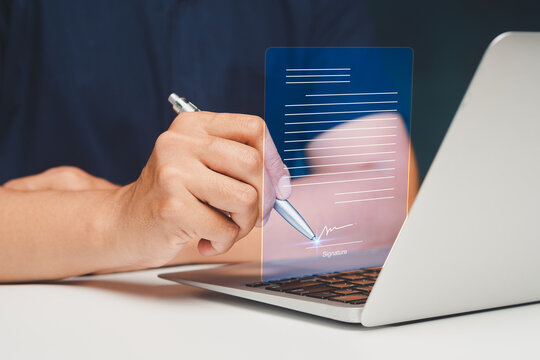 Businessman signing digital document with electronic signature