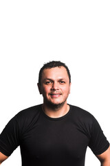 Fototapeta premium Smiling latino man wearing a black shirt with a cheerful expression on a white background.