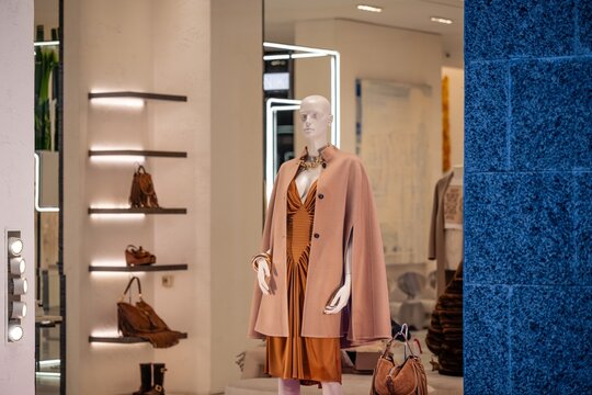 Milan, Italy - 2026, 17 Feb: Gio Moretti SS26 window display featuring elegant neutral-toned fashion, chic accessories, and sophisticated boutique style
