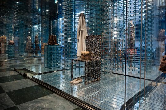 Milan, Italy - 2026, 17 Feb: Giorgio Armani SS26 boutique display with modern glass, reflective surfaces, and elegant accessories highlighting luxury fashion trends