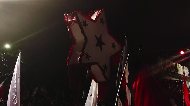 Low-angle shot of banners and flags during the Llamadas parade in Montevideo, Uruguay