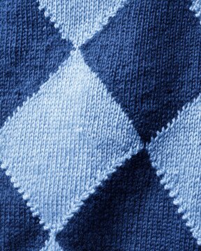 Argyle wool knit, diamond pattern in knitwear, preppy sweater texture macro