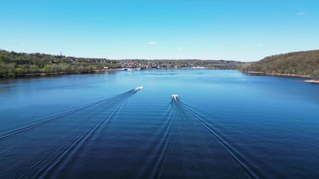 Aerial telephoto shot of the St. Croix River and boats on the water in Stillwater, Minnesota. 4K