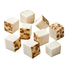 Scattered diced celery root pieces on a white background