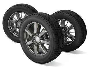 Obraz premium Three car tires on a white background perfect for illustrating automotive themes