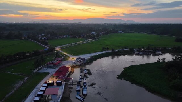 Labuh Banting River Jetty Sunset Over Rice Fields