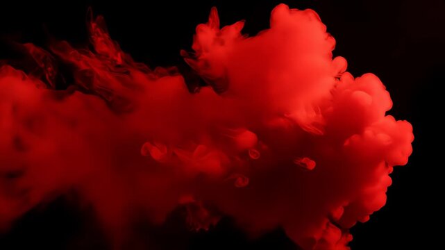 Dense red smoke or fog billows and flows from the left across a black background. Atmospheric overlay for dramatic, horror, or mysterious effects