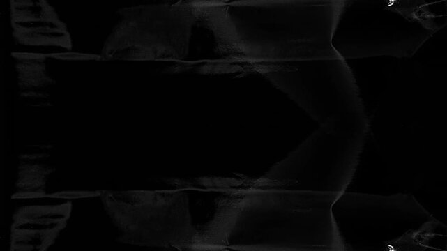 Dark gritty grunge canvas and glossy plastic texture background with stop-motion movement, ideal for cinematic overlays and edgy visual design projects.