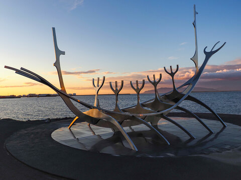 Reykjav&iacute;k, Iceland. Stainless steel Sun Voyager sculpture or S&oacute;lfar, is a sculpture by J&oacute;n Gunnar &Aacute;rnason, located next to the S&aelig;braut road. Beautiful Icelandic evening beside the sea.