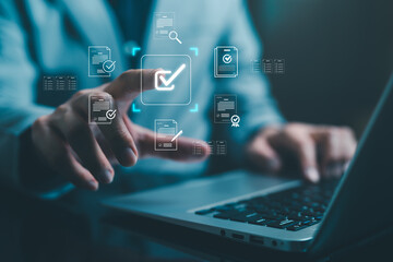 Business professional approving digital documents with virtual checkmark interface, online verification, compliance audit, quality control and workflow management automation concept. © panya7