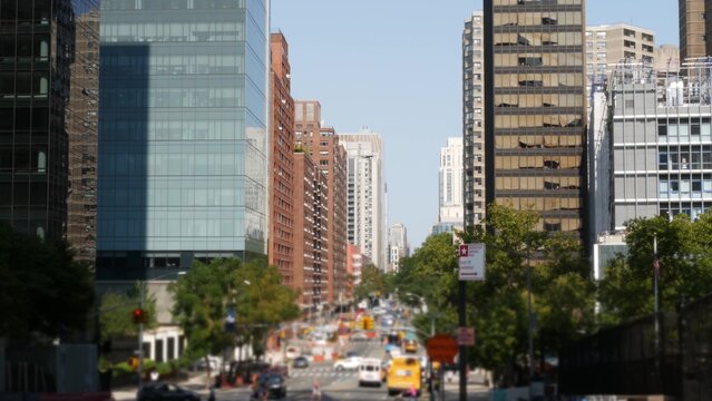 Manhattan Midtown straight street New York City, United States. Lenox Hill district York avenue, Upper East Side buildings. Urban road car traffic from Queensboro Bridge. Crossroad intersections.