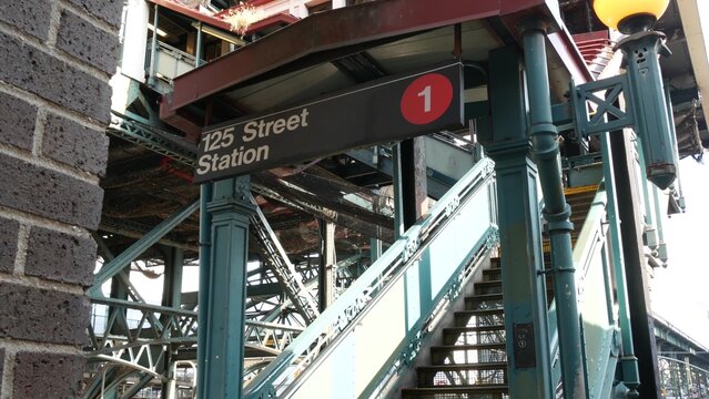 New York City 125 street elevated subway metro entrance in Harlem, United States. American passenger transport, Upper Manhattan. Metropolitan station in NYC USA. Historic architecture, metallic bridge