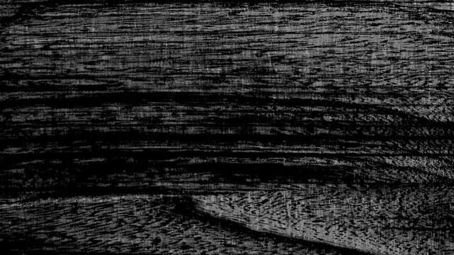 Black and white grunge texture flickering with wood grain pattern