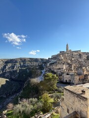Fototapeta premium Carved into stone and shaped by centuries, Matera rises from the rocks of southern Italy like a timeless masterpiece.