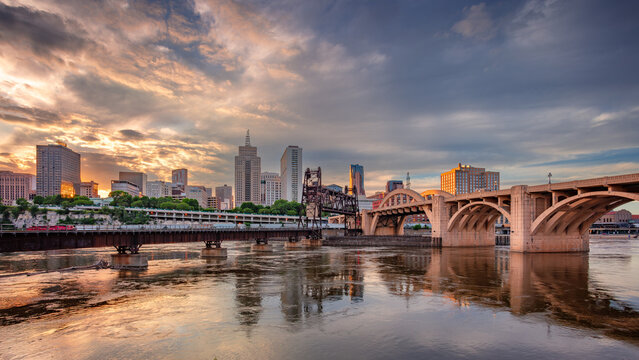 Saint Paul, Minnesota, USA. Cityscape image of downtown St. Paul, Minnesota, USA with reflection of the skyline in Mississippi River at beautiful summer sunset.