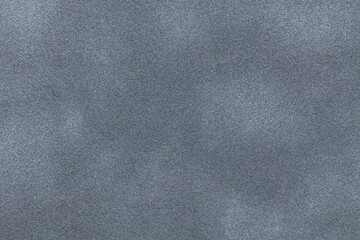 Fototapeta premium Gray suede fabric background with matte nap velvet texture. Graphite tones and soft felt textile surface in macro