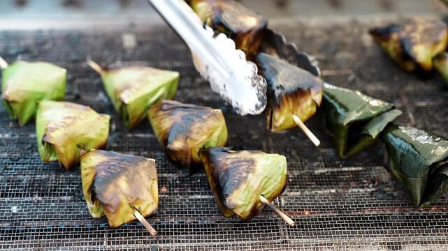 Grilled Sata Street Food Banana Leaf Parcels on Skewers