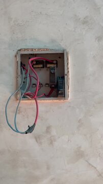 Main electrical outlet with power cord. fixing electrical wires in main fuse box. ideal for illustrating electrical repairs, maintenance, electrician services, and home improvement projects.