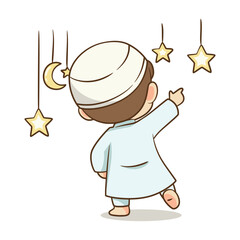 Back view of Muslim boy pointing at hanging moon and stars decoration