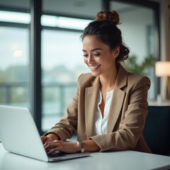 Smiling Businesswoman Working on Laptop in Modern Office Environment