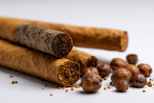 traditional Indonesian kretek cigarette with cloves clearly visible at the tip of the cigarette